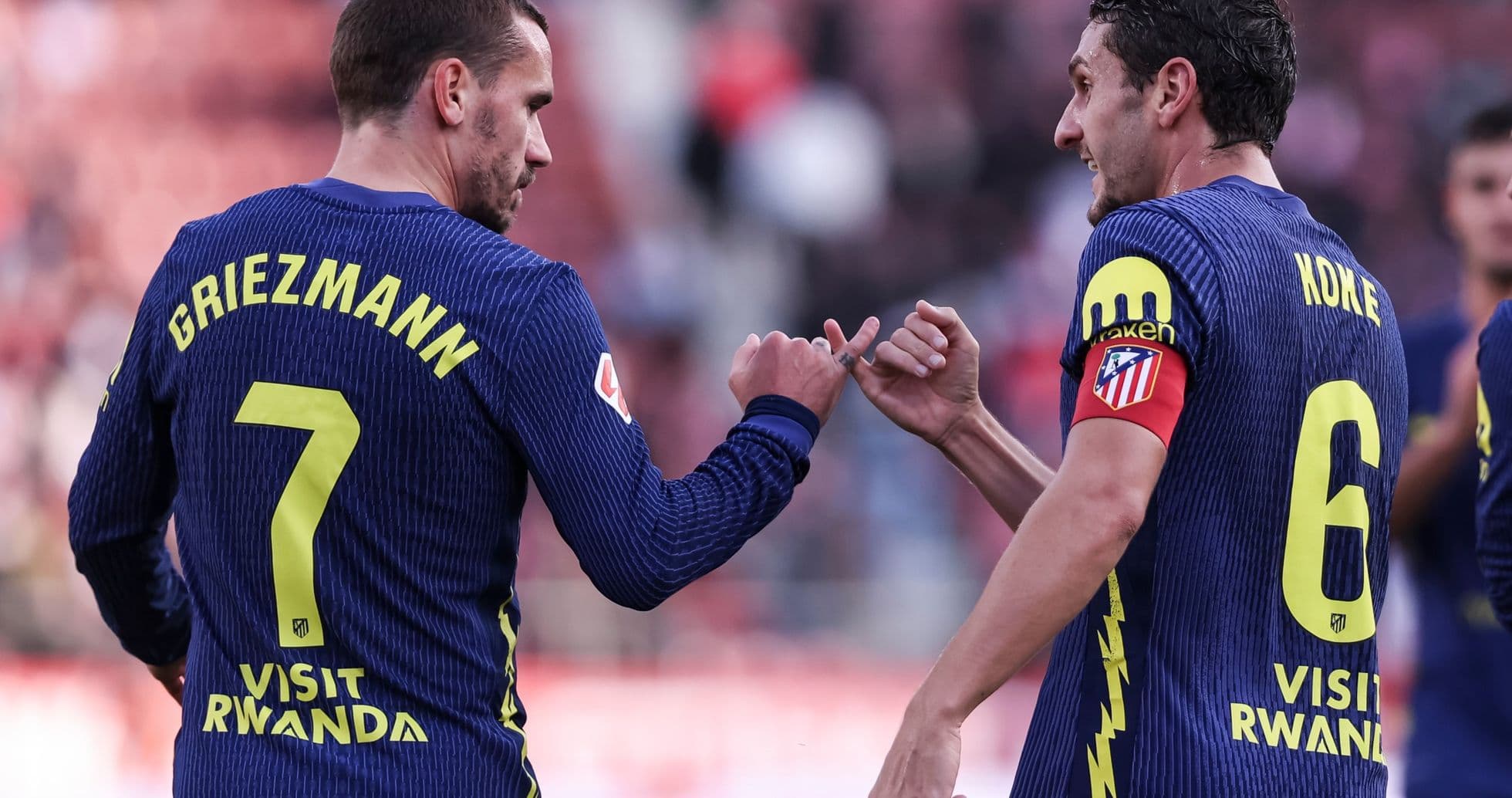 Griezmann y Koke celebrando durante un partido