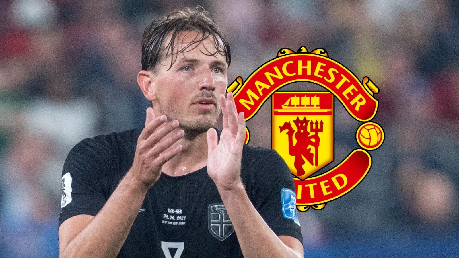 Jugador aplaudiendo con logo de Manchester United